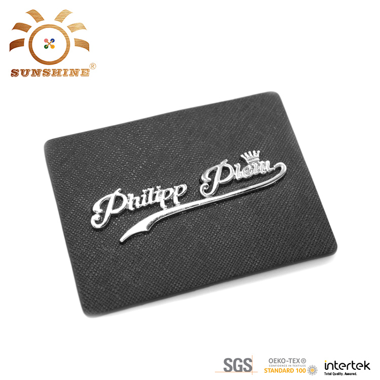 Leather label with metal logo 